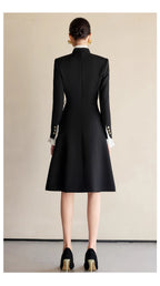 The Contrast-Ruffle Black Dress