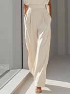 Elegancki kombinezon ecru z marszczeniem i kieszeniami